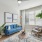 living room with a window, couch, chair, and plant