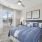 bedroom with a large window, and plants